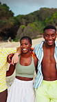 Laughing, friends and walk at beach for holiday, travel or fun together in nature on weekend getaway. Outdoor, group and hug on summer vacation, funny joke and bonding with people on sea adventure