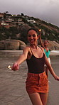 Sparklers, fun and group of people by beach for summer vacation, getaway or weekend trip together. Fireworks, travel and friends by ocean for adventure on seaside holiday with social gathering.