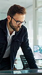 Reading, monitor and glasses with business man in office for sustainability report, eco friendly policy and research. Carbon footprint review, planning and esg insight with employee in agency