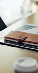 Notebook, documents and desk in empty office with charts, graphs or statistics for finance report. Journal, paperwork and diary for financial project with investment research for career in workplace.