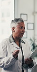 Doctor, woman and tablet for discussion at meeting in hospital with notes, review or insight for wellness. Mature person, tech and team talk for planning, feedback and healthcare services at clinic