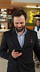 Hotel, lobby and business man with phone for check in, reservation and accommodation. Travel, hospitality and person walking with luggage on cellphone for booking, work trip and conference schedule