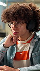 Headphones, thinking and creative man in office, problem solving or social media marketing. Tech, music or business person with idea in workplace for campaign proposal, streaming sound or inspiration