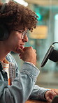 Man, microphone and laptop for podcast with discussion, on air recording and audio conversation. Radio presenter, live stream and person with interview in studio for content creation and talk show