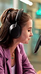 Woman, podcast and headphones in recording studio with mic, pop culture news and chat for broadcast. Happy, person and radio presenter speaking with audio tech, talk show and mainstream media update.