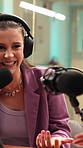 Woman, podcast and interview in recording studio with mic, broadcast and laugh for funny discussion. Happy, creative people and guest speaking with headphones, collaboration and joke for talk show.