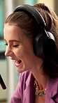 Podcast, mic and woman laugh with headphones, funny discussion and live broadcast in recording studio. Happy, person and radio presenter speaking with audio tech, entertainment or joke for talk show.