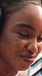 Black woman, relax and reading with headphones in home for streaming music, listening audio and smile. Happy, african person and social media with headset for podcast, technology and subscription