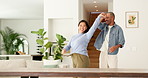 Happy couple, dance and holding hands with love in home for bonding, connection and playful in lounge. Man, woman and partner with rhythm, care and fun in relationship with movement at apartment