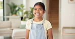 Happy, laugh and face of child in home to relax on weekend, holiday and free time in living room. Excited, humor and portrait of girl with funny joke, good mood and confidence for positive attitude