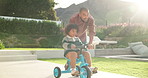Learning, bicycle and father with child in nature for bonding, activity or love together on weekend. Happy, teaching and dad with girl kid with cycling on bike outdoor in park for connection.