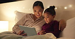 Tablet, night and mom with child in bedroom for bonding, connection and reading story for bedtime. Happy, family and mother embrace girl on tech for watching videos, internet and relax in bed in home