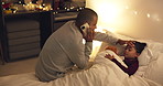 Night, dad and phone call with sick child in bed for telehealth, advice or fever in home. Father, talking or monitoring kid with smartphone or assistance for childcare, illness or virus in bedroom