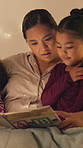 Mother, relax and reading book with children in bedroom for education, learning letters and bedtime. Night, woman and kids with academic story, language development and alphabet storytelling at house