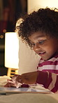 Relax, tablet and child in bedroom at house at night with choice on movie, show or series online. Happy, digital technology and girl kid with streaming film on app, website or internet in apartment.