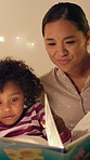 Smile, mother and reading book with child in bedroom for education, fantasy novel and bedtime routine. Night, woman and daughter with fairytale story, language development and storytelling at house