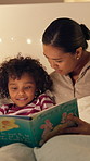 Mother, reading and book with child in bedroom for education, fantasy novel and bedtime routine. Night, woman and daughter with fairytale story, language development and fiction storytelling at house
