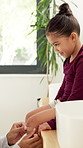 Bathroom, help and parent with bandage for child with injury, accident and hurt on knee in home. Family, love and person with girl for first aid, assistance and plaster for healing, care and support