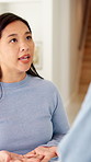Upset, argument and woman in home with disagreement, conflict or affair confession in living room. Angry, fighting and Asian female person with toxic marriage for relationship dispute or cheating.