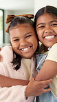 Sisters, face and girls hug in home with love, care and kids with support on sofa in living room. Happy, portrait and children bonding in embrace together with laugh in lounge of apartment or house