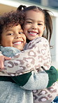 `Happy, hug and face of children outdoor on weekend break with bonding, love and friendship. Smile, nature and portrait of kids embracing for playing, adventure or positive attitude together in park.