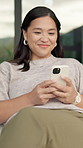 Phone, relax and woman outdoor in backyard with texting, networking or social media on mobile app. Happy, technology and Asian person with cellphone for chatting, message or notification online.