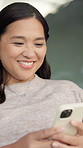 Smile, woman and reading with phone at house for social media, dating app and flirty message. Happy, female person and mobile for online interaction, love interest and expression for texting crush