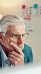 Serious, businessman and thinking in office with computer, accounting and glasses for audit review. Mature person, reading and financial auditor in firm with desktop, problem solving or check report.