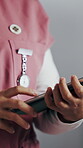 Hands, nurse and tablet in hospital for research, schedule update or healthcare information. Woman, tech and typing in clinic for telehealth platform, digital report or medical app for efficiency