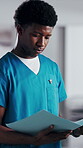 Man, nurse and folder in hospital for information, schedule update or healthcare service. Medical attendant, reading file and record in clinic for efficiency, referral feedback and residency report