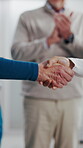 Healthcare, team and shaking hands in hospital, agreement and celebration for achievement in meeting. Clinic, applause and handshake for medical success, support and collaboration for health goals