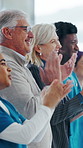 Happy, board and people with applause at hospital for good news, success and insurance approval. Manager, healthcare and team of doctors clapping for achievement, medicine funding or medical service