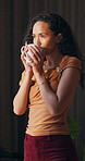 Woman, thinking and drink coffee in home with smile, reflection and insight with aroma in morning. Person, happy and perspective with beverage, tea and flavor with nostalgia for daydream at house