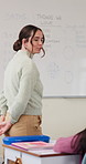 Talking, woman and teacher in classroom at elementary school with math explanation for curriculum. Support, students and female educator with education lesson for helping with study tips at academy.