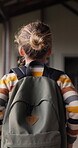 Walking, back or child with backpack in school for curriculum, academic development or lesson journey. Education, student or girl with bag for learning, knowledge growth or academy hallway for future