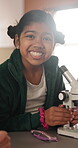 Child, face and microscope for education in classroom, learning and happy with scientific experiment. School, student and kid with magnifier instrument for biology lesson, development and knowledge