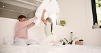 Morning, siblings and children with pillow fight in bedroom for bonding, playful fun and weekend. Family, happy and boy with girl on bed for laughing, playing and relationship in home for childhood