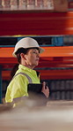 Woman, walk and tablet in warehouse with logistics management, stock inspection or quality assurance. Mature person, supervisor and check inventory in depot with tech, supply chain or PPE for safety.
