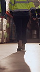 Walking, shipping and legs of people in warehouse for supply chain, distribution and stock inspection. Factory, storage depot and back of workers in aisle for logistics, inventory and delivery