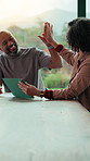Happy, couple and high five with tablet in home, financial report or mortgage eligibility on website. Mature African people, success and plan for dream house purchase, smile and celebration with tech
