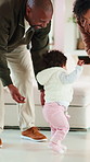 Excited, family and baby learning to walk in home with guidance, applause or child development. Parents, clapping and encourage kid for first steps, growth milestone and proud moment for coordination