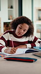 Girl, writing and book for education for homework for project, solution and cognitive development in lounge. Child, notes and study with learning, problem solving and drawing with creativity at house