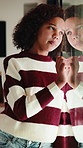 Sad, child and thinking at window in home with stress, abandoned and trauma from separation. Reflection, orphan and girl with depression in house from rejection and waiting on adoption at foster care