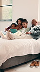 Parents, children and relax on bed with tablet, smile and bonding with movies on streaming service. People, kids and happy with tech, app and film with subscription, care or love in family house