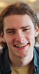 Happy, laugh and face of man in home with good mood, positive attitude and funny joke on weekend. House, confidence and portrait of person with smile, humor and relax for break, me time and peace