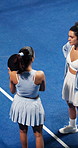 Talking, padel and above of women on court for training tips, exercise and practice together. Coach, friends and people in conversation with tennis skills for match, tournament and prepare for game