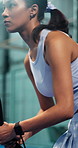 Sports, padel and woman swinging on court with game, challenge and practice for competition. Person, athlete or tennis player on turf and hitting racket for contest, technique or tournament