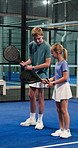 Padel tennis, sports and children with racket on court for activity, exercise and training together. Fitness club, siblings and boy teaching girl for game, match help and tournament for practice