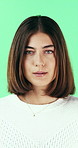 Nervous, woman and student with face in studio for education, exam stress and academic pressure. Portrait, person and breathe with anxiety, studying challenge and learning results on green background