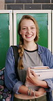 Face, laugh or teen in high school with books, knowledge or scholarship in academic development. Education, portrait or happy child with textbooks, student humor or growth in learning opportunity.